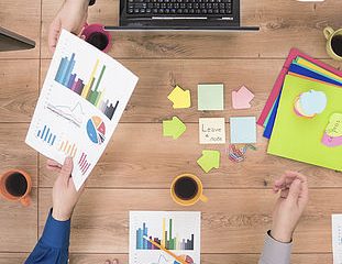 Business team analyzing financial data on a meeting